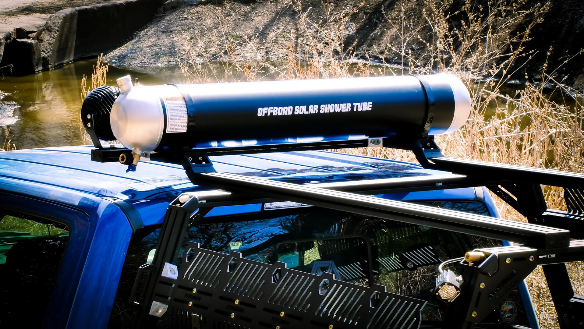 Off-road solar shower tube on a jeep