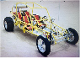 A yellow and red buggy is in the middle of a room.