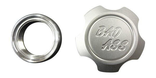 A silver cap and ring with the words " baju asia ".