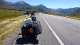 A motorcycle is parked on the side of a road.