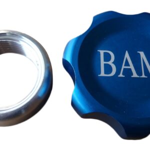 A blue cap and a silver ring with the word bam on it.