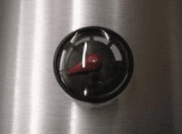 A close up of the knob on an oven