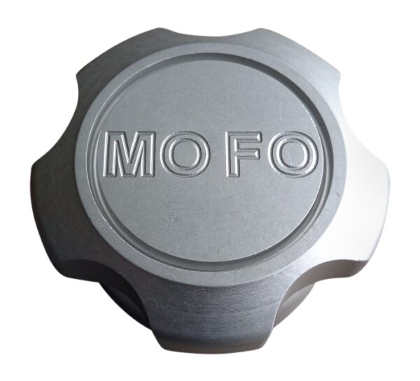 A mofo logo on the side of a silver cap.