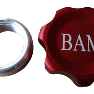 A red cap and a silver ring with the word bam on it.