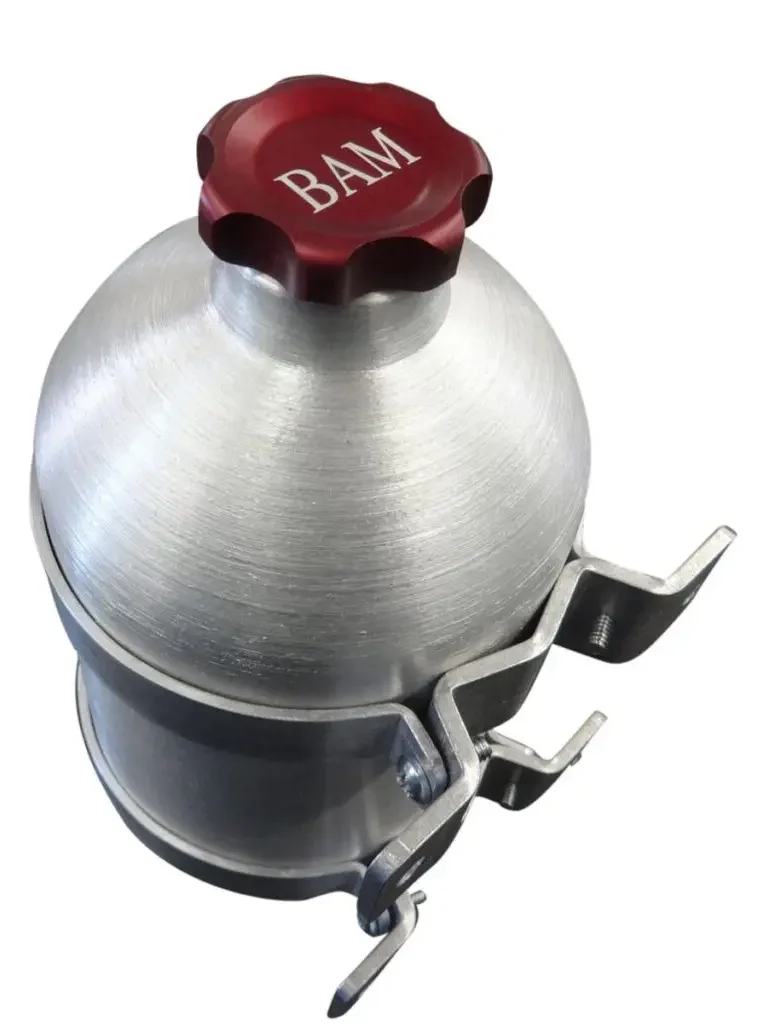 A silver and red ball shaped container with the name bam on it.