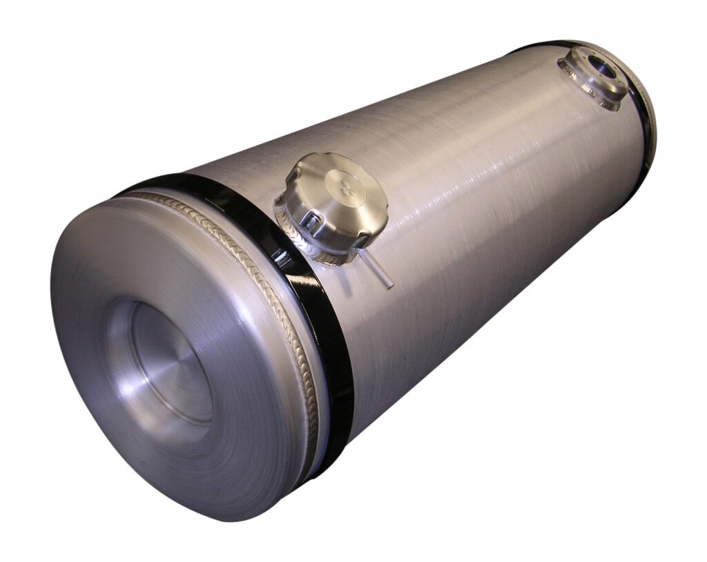 A silver cylinder with two black and one white dot.