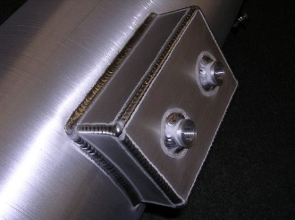A metal box with two holes on top of it.