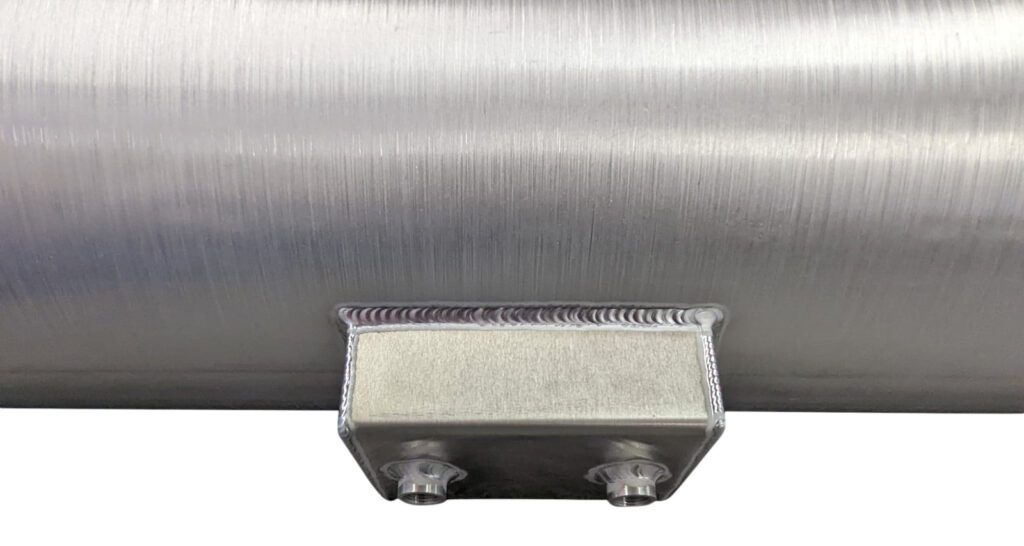 A close up of the side of a metal pipe