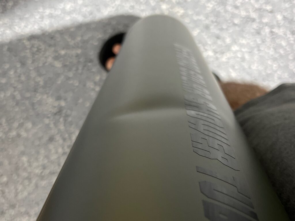 A person is standing on the ground with their feet up.
